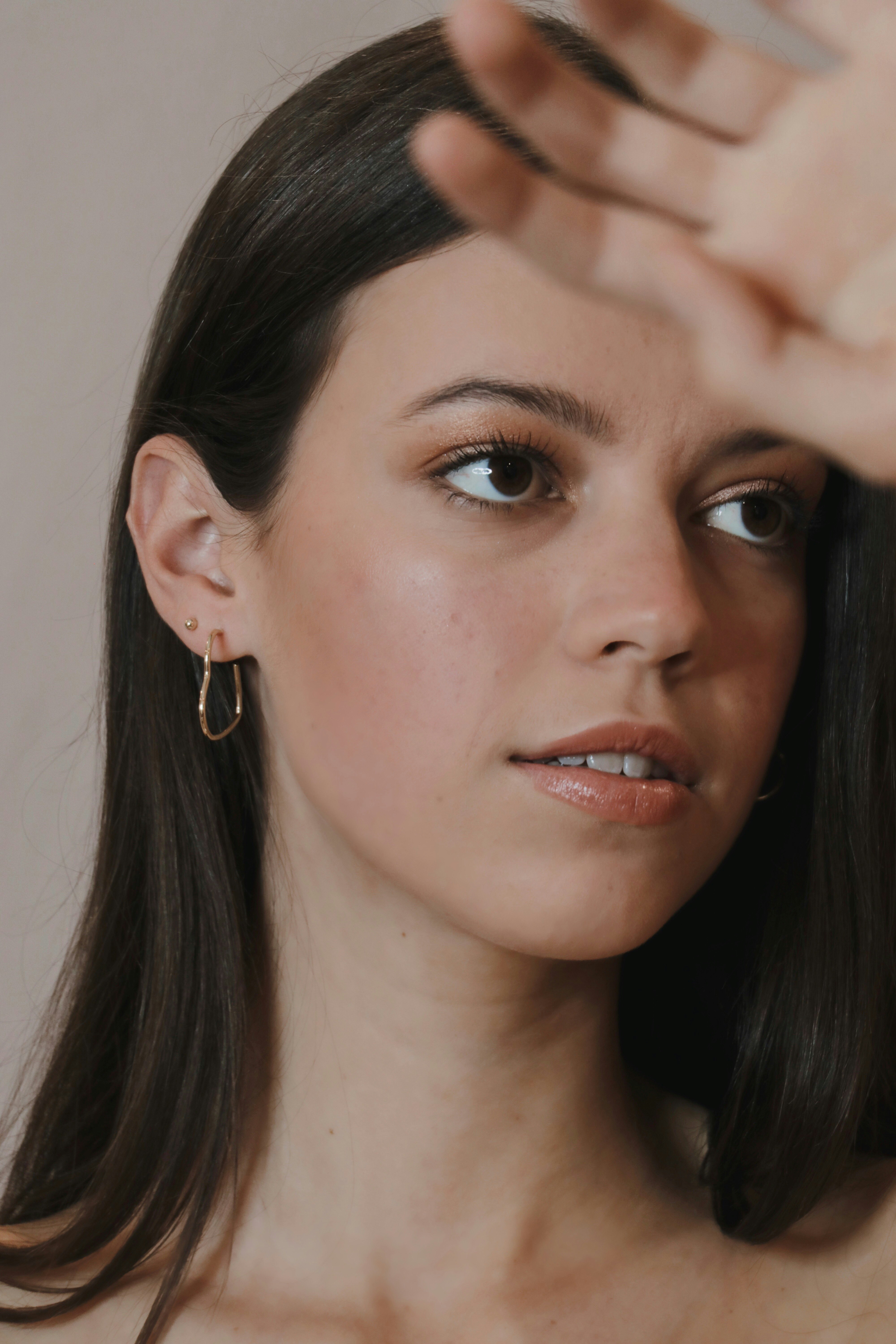 woman wearing silver stud earring